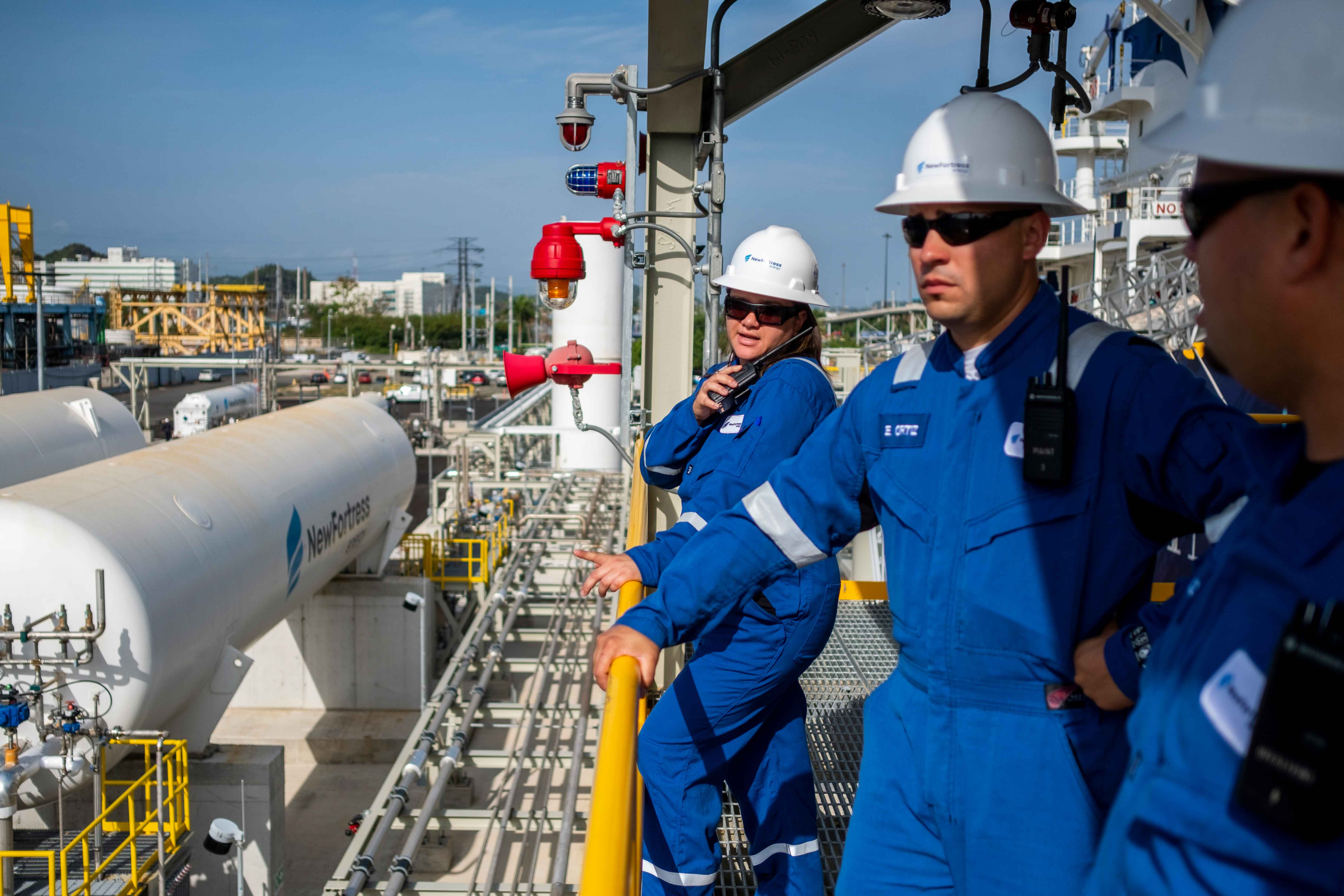 NFE employee standing on LNG plant 