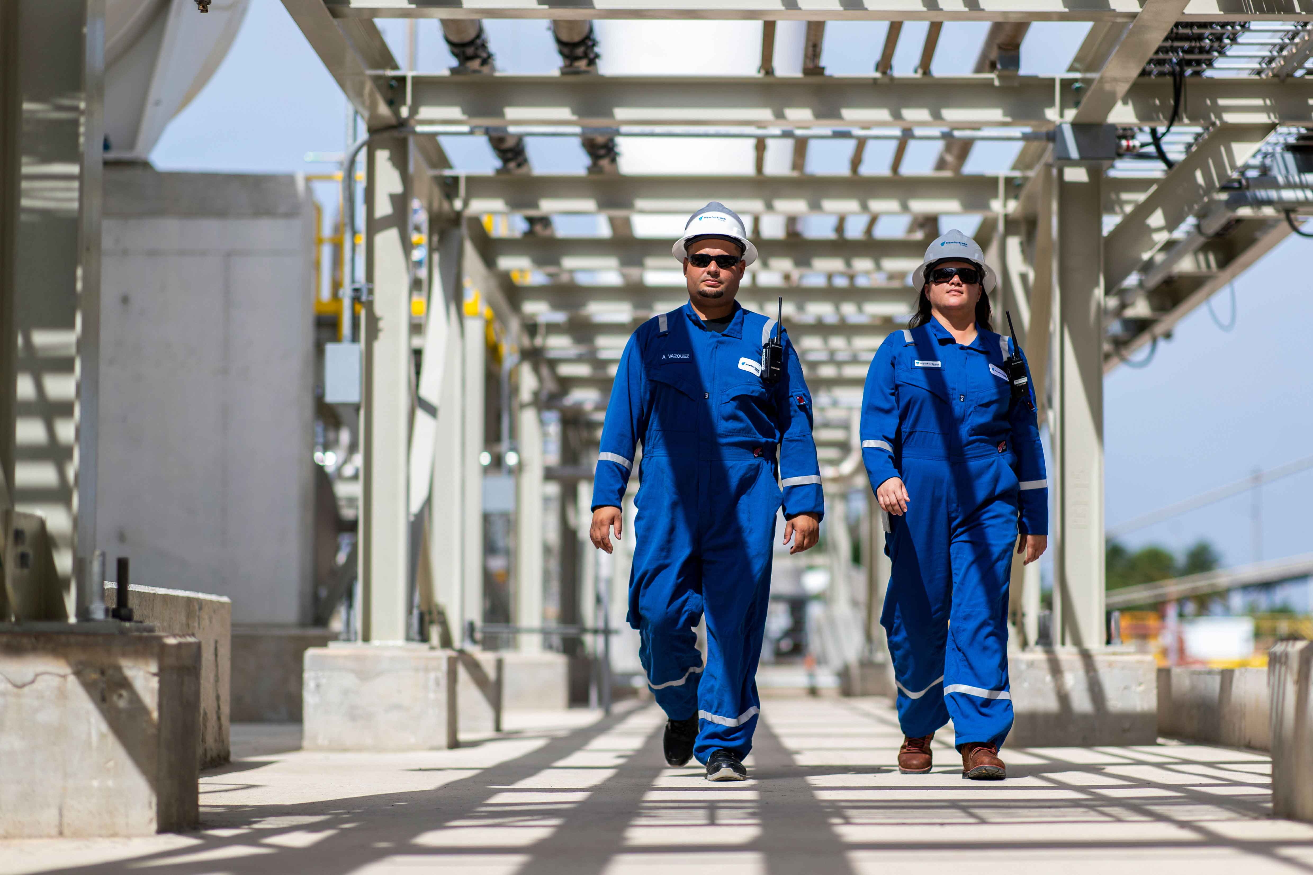 NFE employee standing on LNG plant 