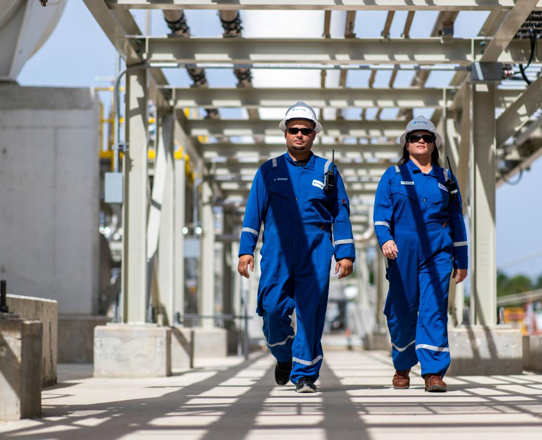 NFE employee standing on LNG plant 
