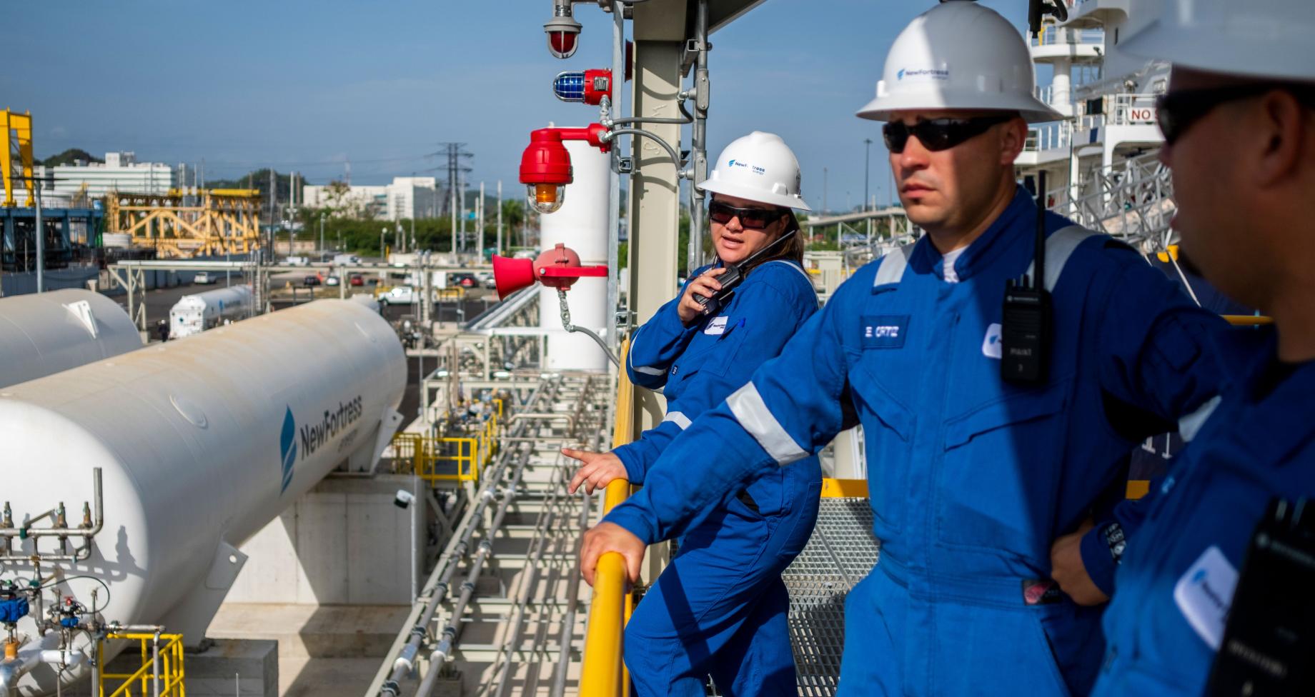 NFE employee standing on LNG plant