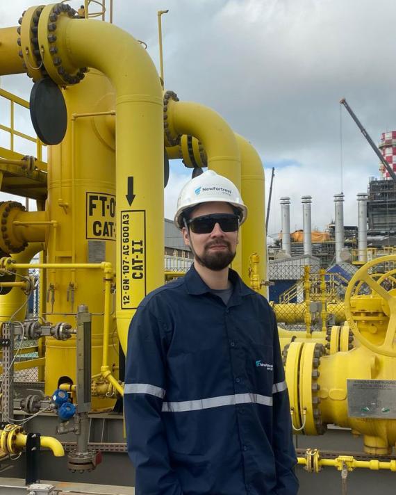 NFE employee standing on LNG plant 