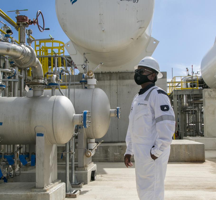 New Fortress Energy employee with mask at terminal