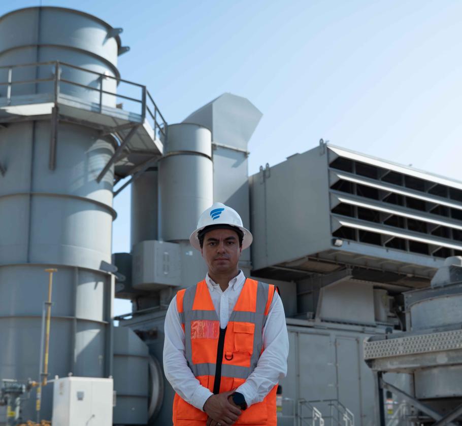 NFE employee standing on LNG plant 