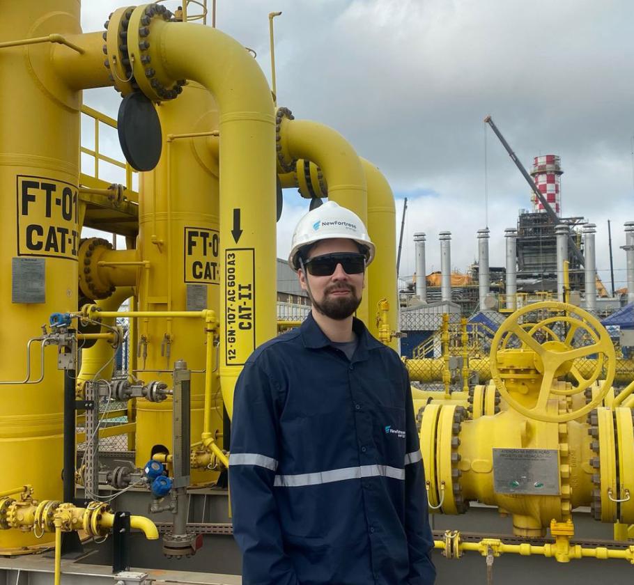 NFE employee standing on LNG plant