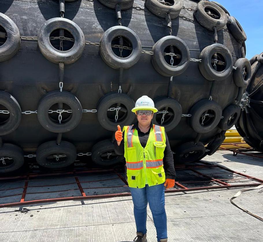 NFE employee standing on LNG plant